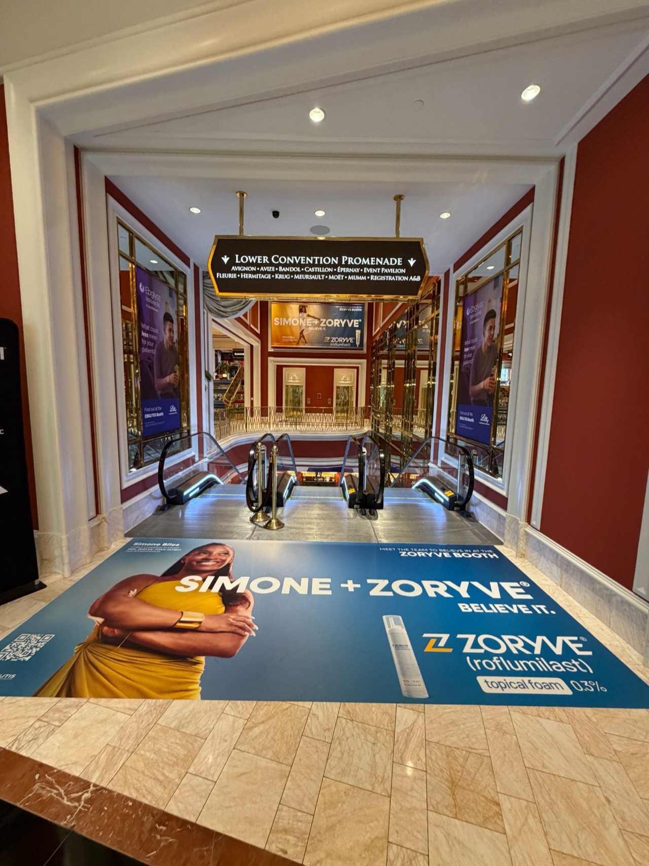Pharma conference graphics at Wynn Las Vegas — Escalator-landing floor graphic, window graphics and table wraps for two pharma sponsors at the Fall Clinical Dermatology meeting — Las Vegas, NV