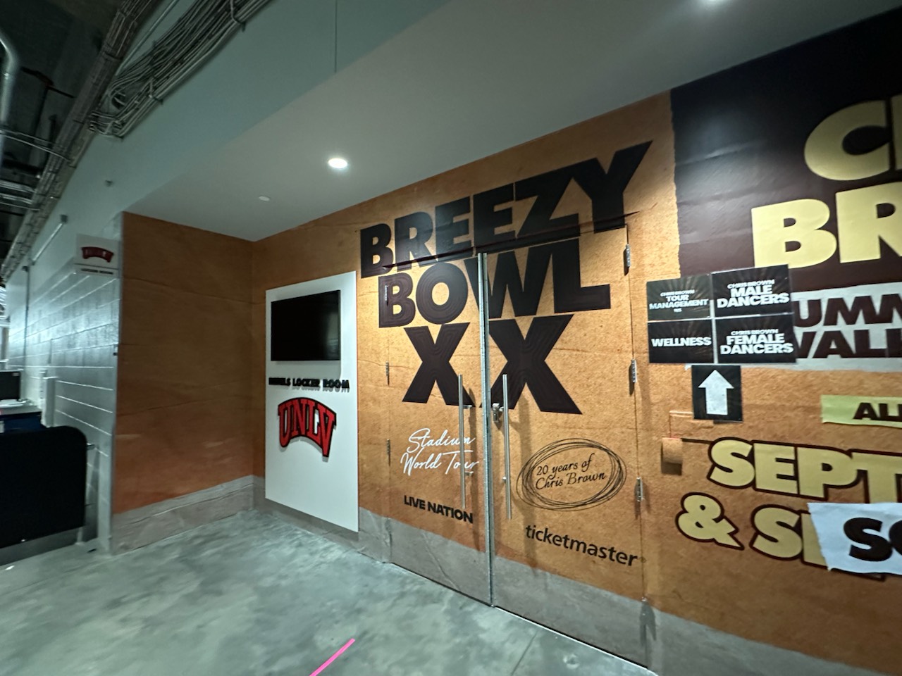Breezy Bowl XX tour graphics on a stadium hallway wall