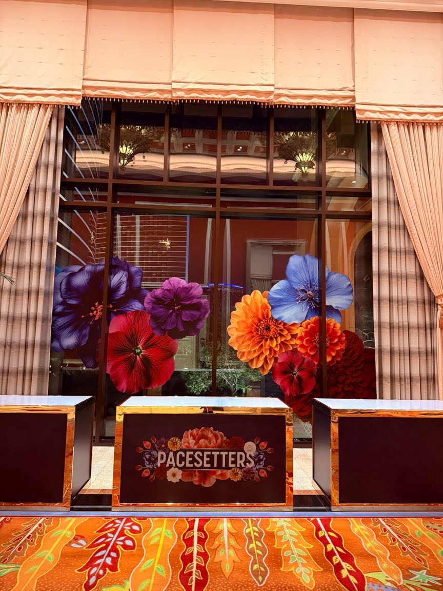 Floral window graphics behind Pacesetters branded counters