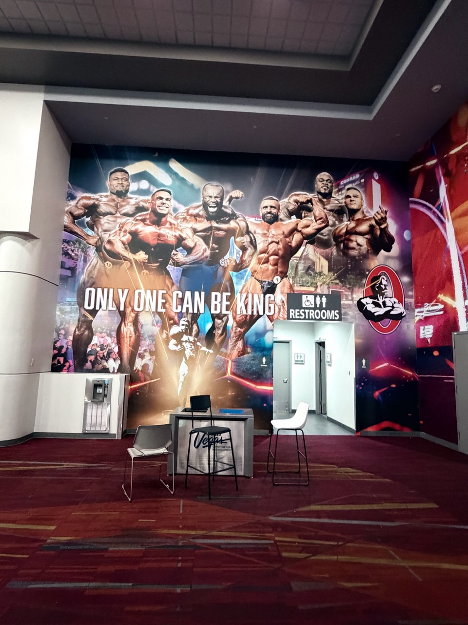 Only One Can Be King Mr. Olympia feature wall at a convention center