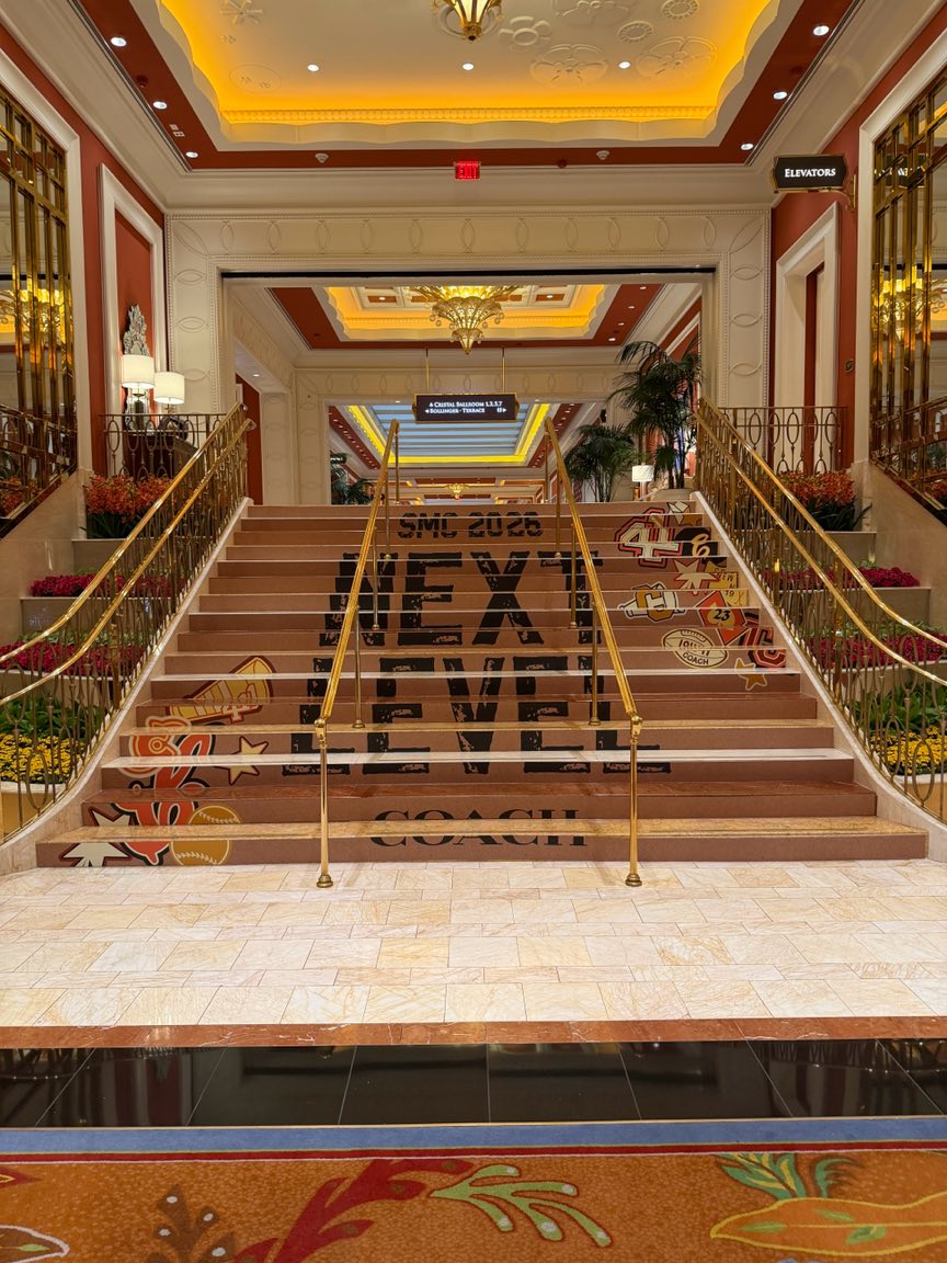 Next Level Coach stair riser graphics on a grand hotel staircase