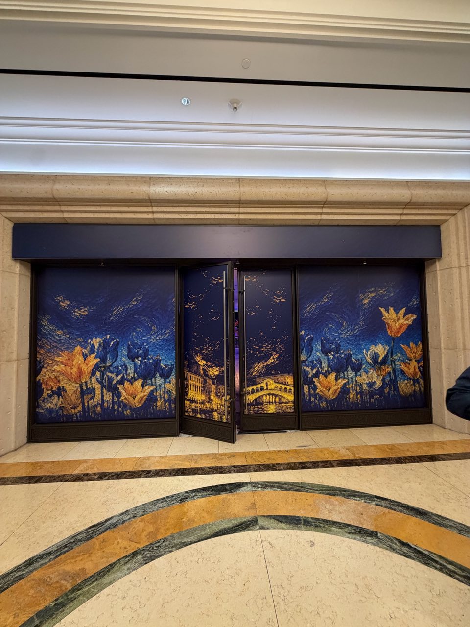 Gold tulip and Venice skyline graphics on double doors