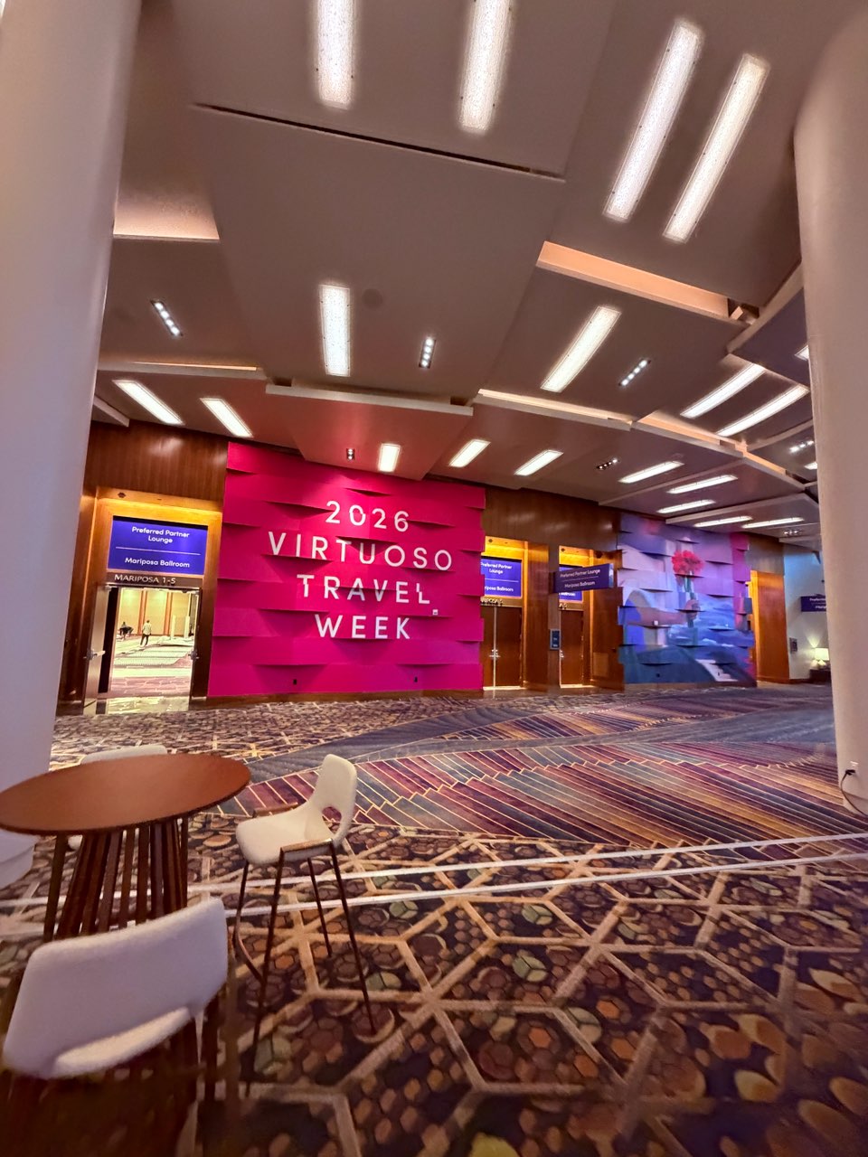 Pink Virtuoso Travel Week 2026 foyer wall wraps